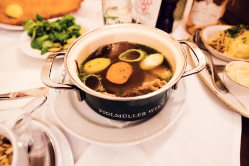 Traditional Tafelspitz boiled beef dish with root vegetables and horseradish sauce at Figlmüller Wollzeile.