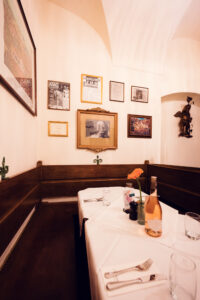 Cozy traditional Austrian restaurant atmosphere inside Figlmüller Wollzeile with vintage furnishings.