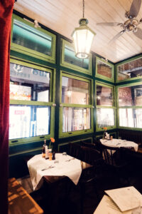 Historic dining room interior at Figlmüller Wollzeile with wooden tables and traditional Austrian decor.