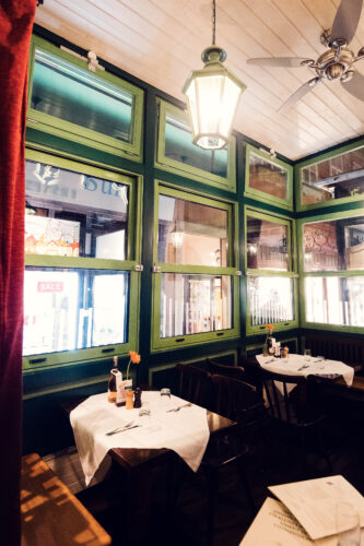 Historic dining room interior at Figlmüller Wollzeile with wooden tables and traditional Austrian decor.