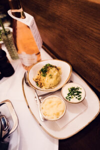 Figlmüller Wollzeile Tafelspitz platter with tender beef, soup vegetables, and traditional condiments.