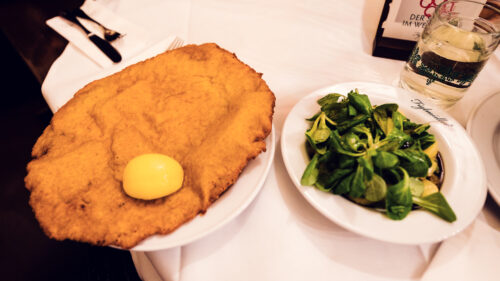 Traditional Wiener Schnitzel served at Figlmüller Wollzeile with potato salad and lemon.