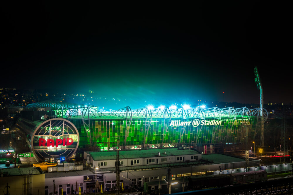 The Allianz Stadion in Vienna lit up in green at night, home of SK Rapid Wien