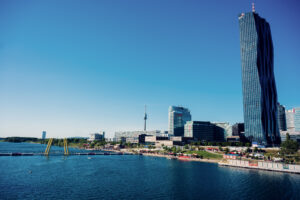 Panoramic view of the Neue Donau with the Donau City skyline and DC Tower behind Copa Beach.